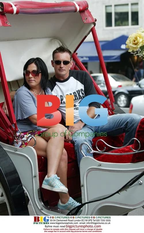 Celebrity couple on sunny beach
