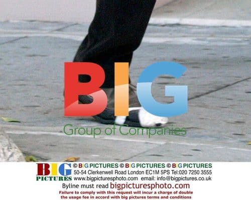 Keanu Reeves repairs shoe with tape