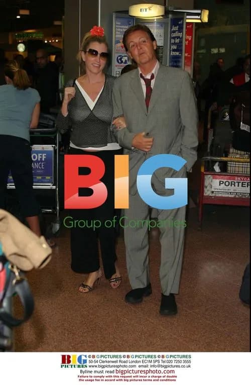 Paul McCartney and pregnant wife arrive at Heathrow
