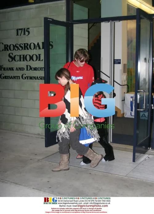 Kutcher and Moore with kids after Clippers practice