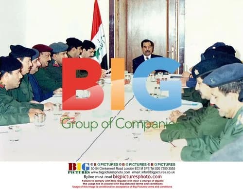 Saddam Hussein at army meeting