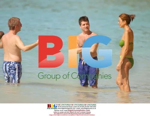 Simon Cowell on Beach with Girlfriend