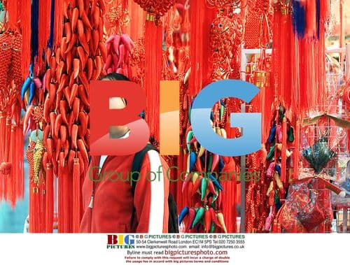 Woman Checking Chinese Knots in Shanghai Bazaar