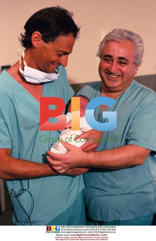 Doctor and nurse with baby