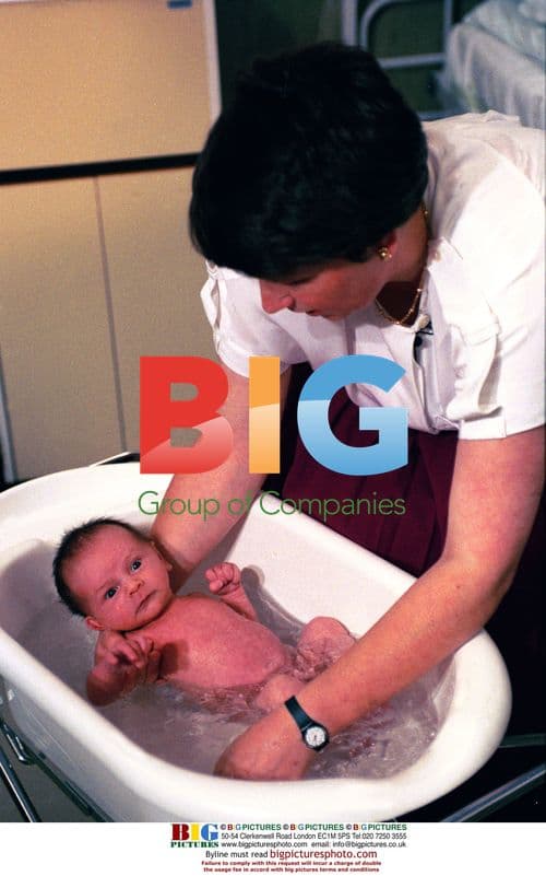 Baby being nurtured in bath tub