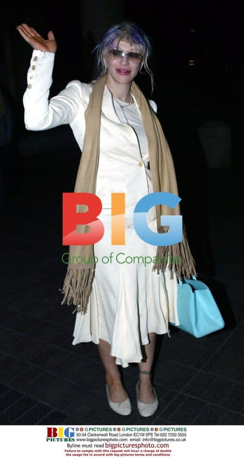 Courteney Love Lands Quietly at LAX