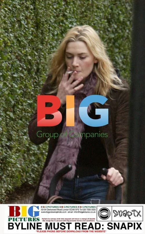 Kate Winslet Seen Frowning and Smoking in London