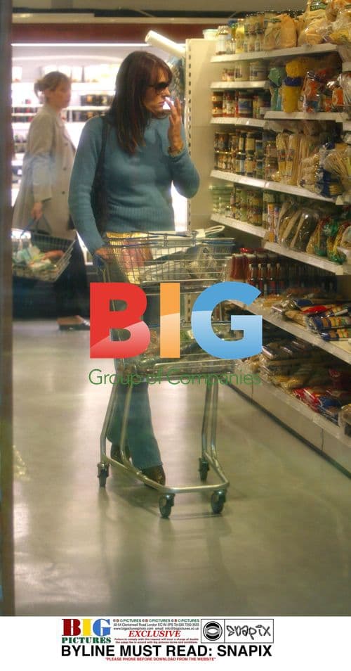 Liz Hurley has trousers trouble getting out of car