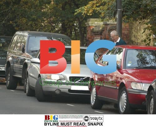 Nicholas Parsons runs to car for next errand