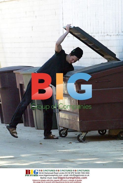 Keanu Reeves takes out trash