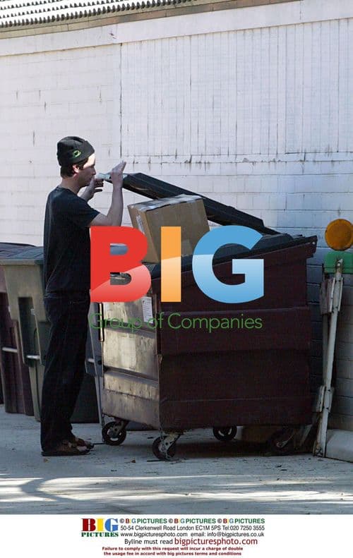 Keanu Reeves Takes Out the Trash