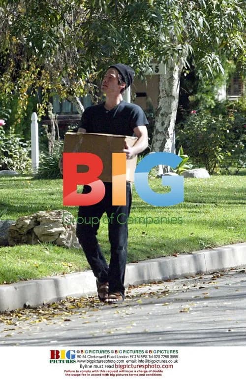 Keanu Reeves takes out trash