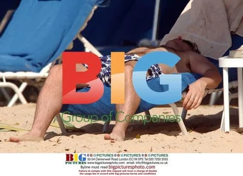 Tom Hollander on beach in Barbados