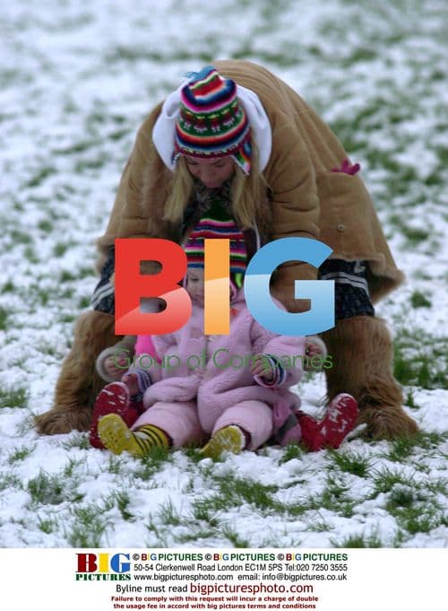 Meg Matthews and Daughter Play in Snow