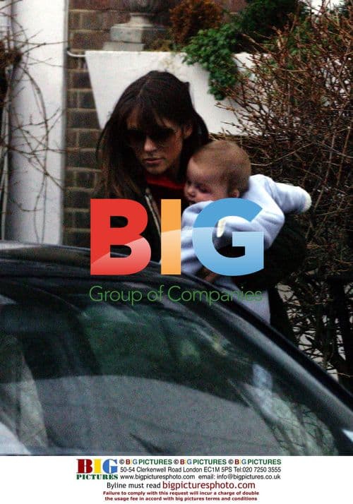 Liz Hurley with baby Damian leaving home