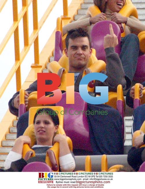 Robbie Williams hikes with dogs, visits theme park