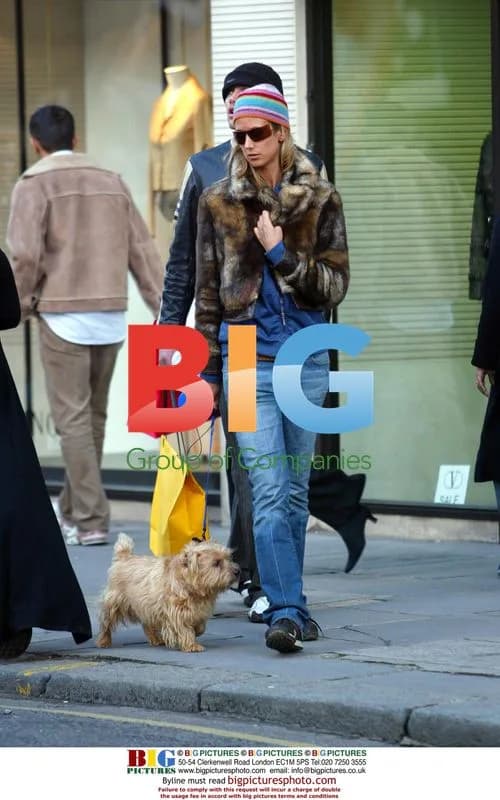 Lady Victoria Hervey out with dog and male friend in London