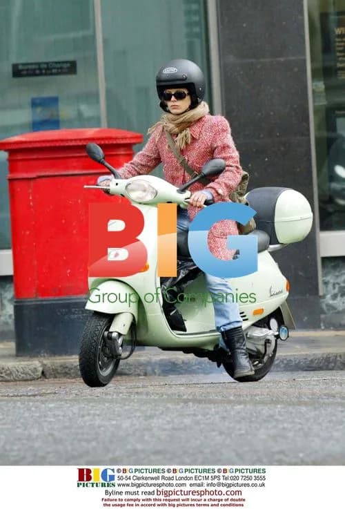 Laura Bailey on Vespa after shopping