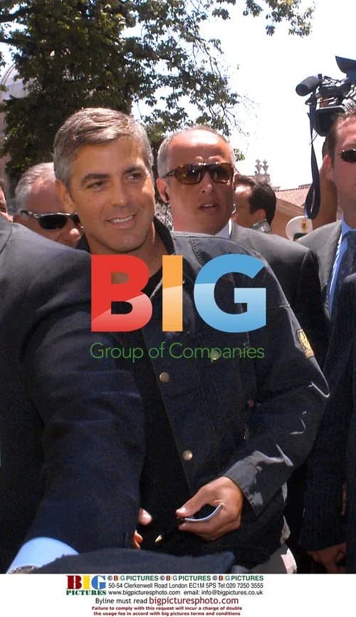 George Clooney and Lucio Dalla at charity event
