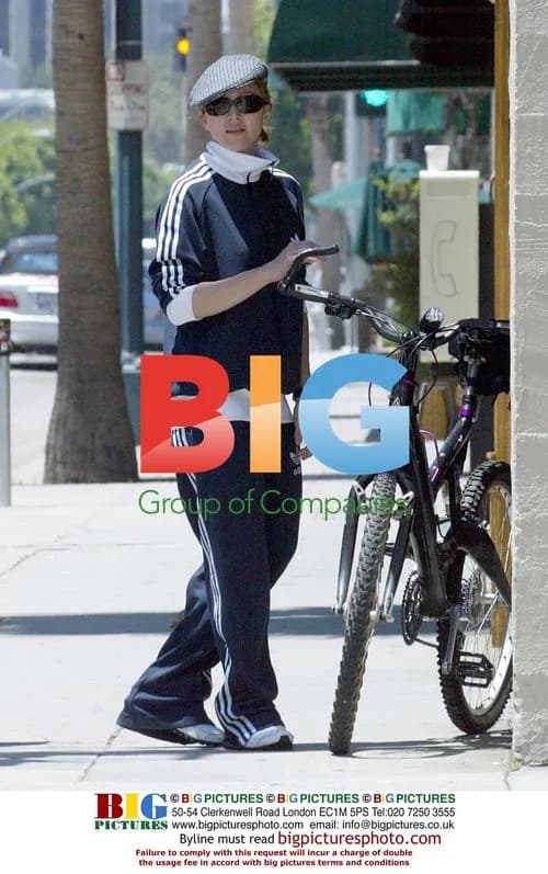 Madonna riding bike, gives autograph to cop