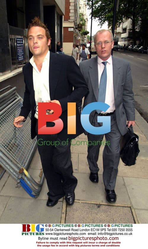 Rupert Young arrives at court on assault charges