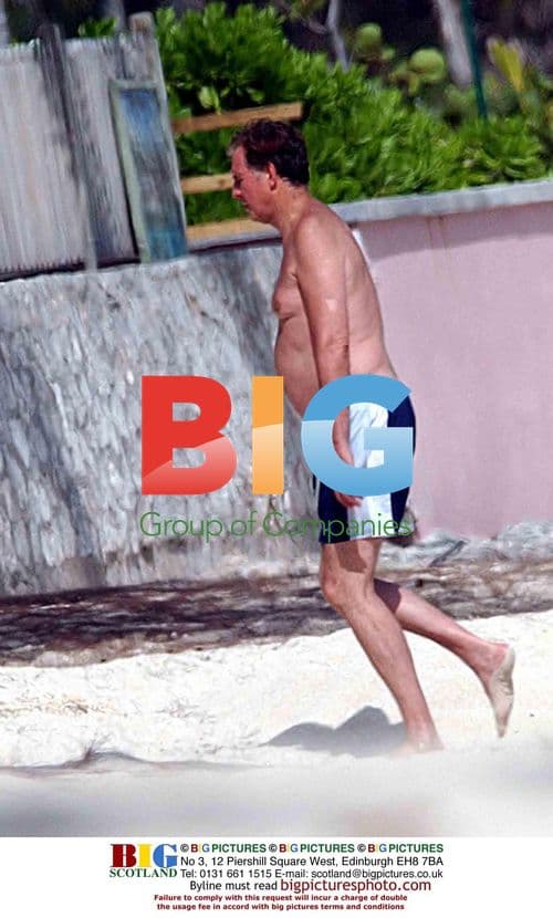 Former MP Jonathan Aitken Strolls on Caribbean Beach