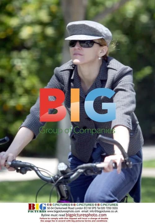 Madonna riding bike, gets shoe caught