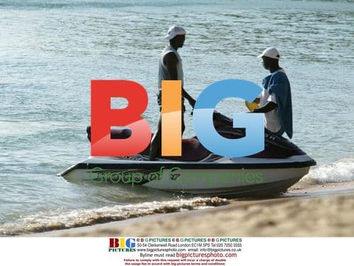 Footballer Dwight Yorke on Jet Ski with son