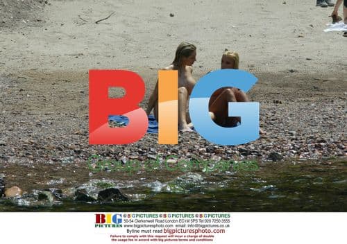 Playboy TV Host and Model Frolic on Beach Vacation