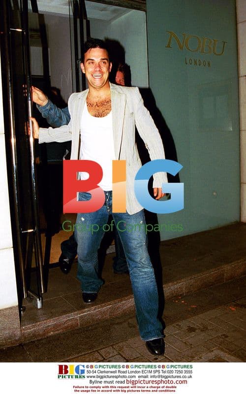 Robbie Williams Laughing After Dinner