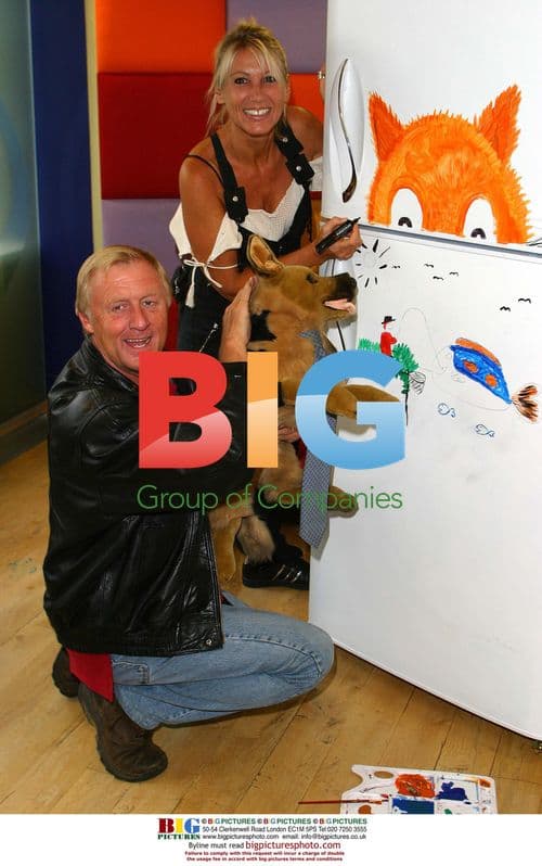 Chris Tarrant and wife paint fridge for charity