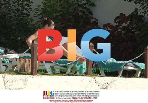 Kirsty Gallagher sunbathes in Barbados