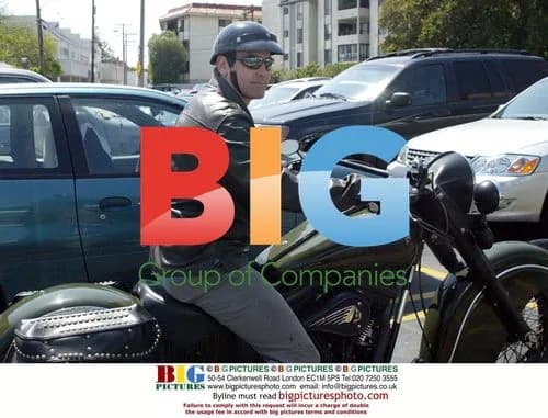 George Clooney on motorcycle, stops to give panhandler money