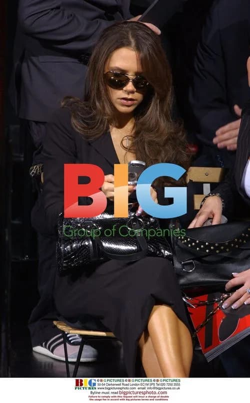 Victoria Beckham and Sister at Dolce & Gabbana Fashion Show
