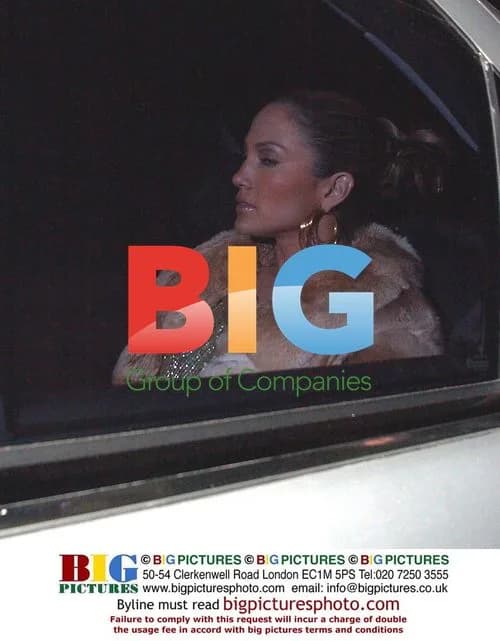 Jennifer Lopez Exits Bar in Coat