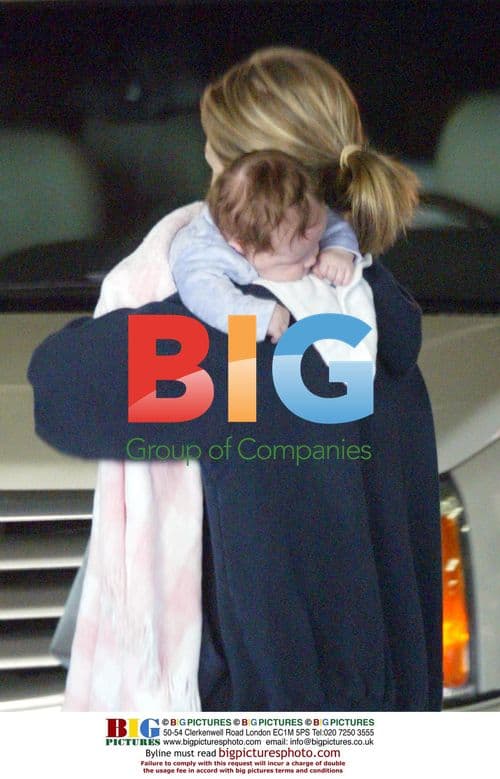 Jenny Garth with daughter and baby at park