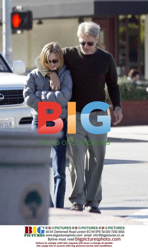 Calista Flockhart and Harrison Ford stroll in Brentwood
