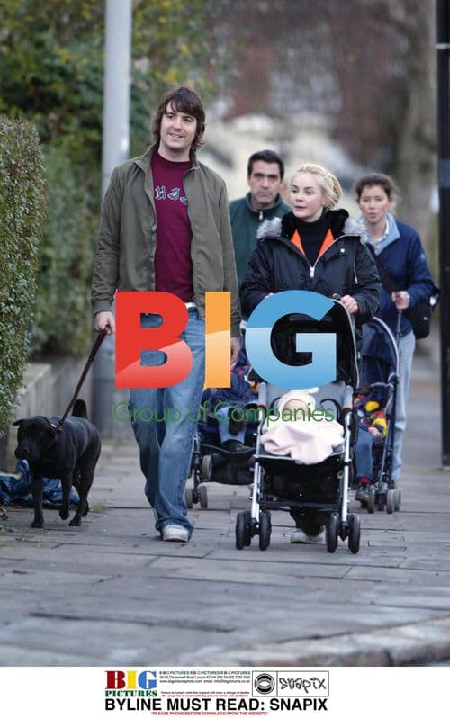 Gail and Dan Hipgrave walking with baby Honey