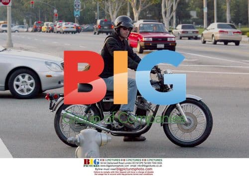 Keanu Reeves Rides Motorcycle in Beverly Hills