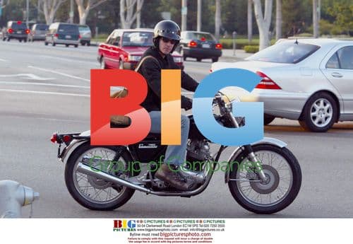 Keanu Reeves Rides Motorcycle in Beverly Hills