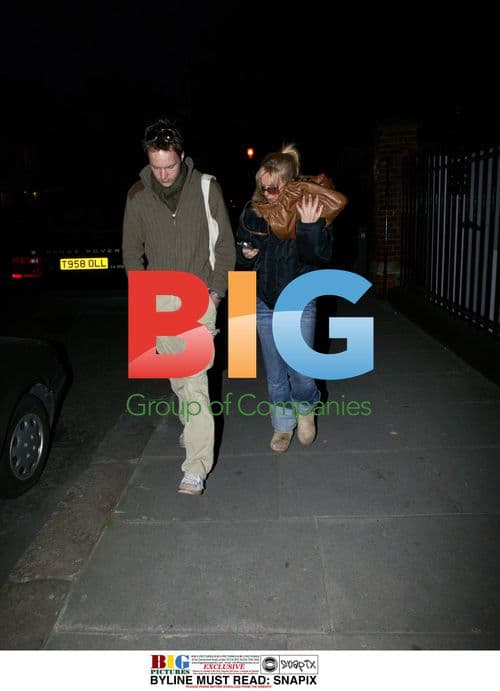 Geri Halliwell hiding behind friend in London