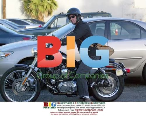 Keanu Reeves Leaves Gym on Motorcycle