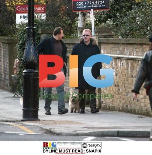 Les Dennis walks dogs with friend in London
