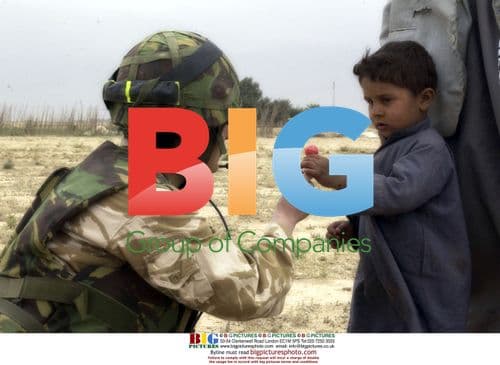 RAF Officer Gives Candy to Iraqi Child