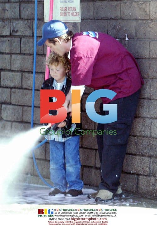 Luke Perry and son wash car in Westwood
