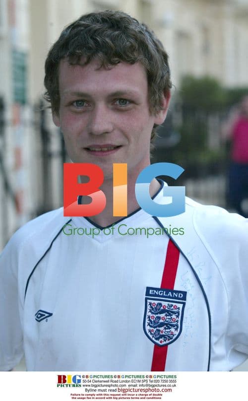 Chris Martin Signs Fan Shirt After Jog