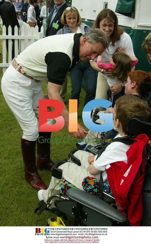Prince Charles Speaks with Children at Polo Match
