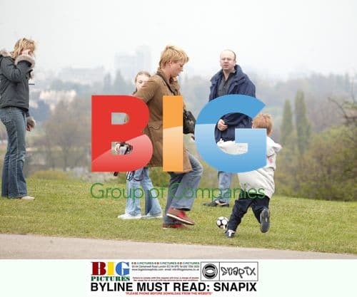 Sara Cox Enjoys Family Outing with Dog in London