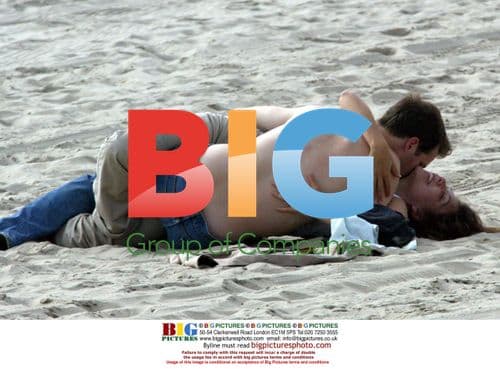 Maggie Gyllenhaal and Peter Sarsgaard on the beach