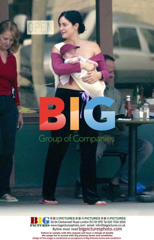 Carrie Ann Moss with Husband and Baby